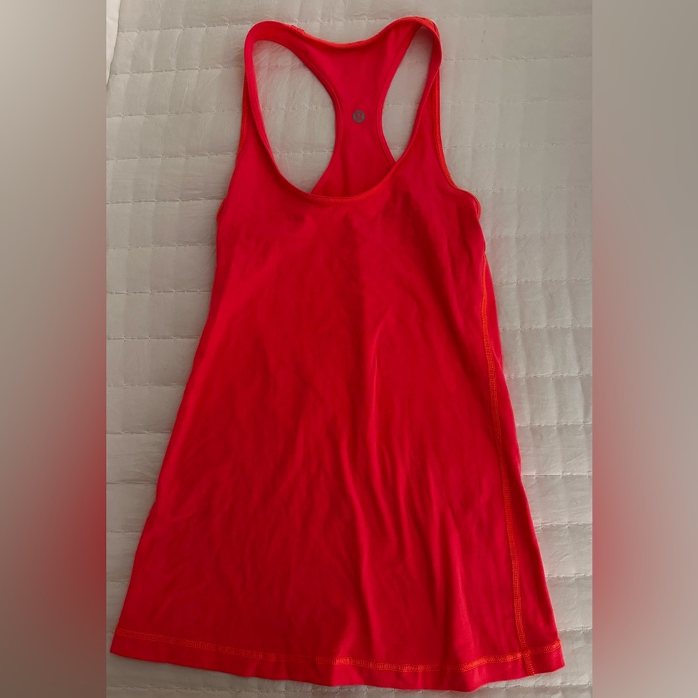Bright lululemon razorback tank.